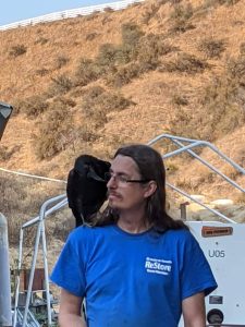 Wayne Beach with a crow on his shoulder