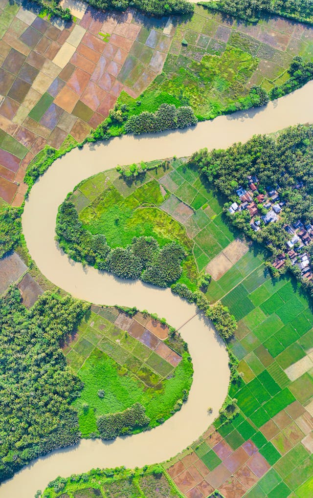 Aerial image of farmland surrounding a river bend